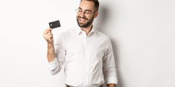 A happy man with his American Express Aeroplan Reserve card.