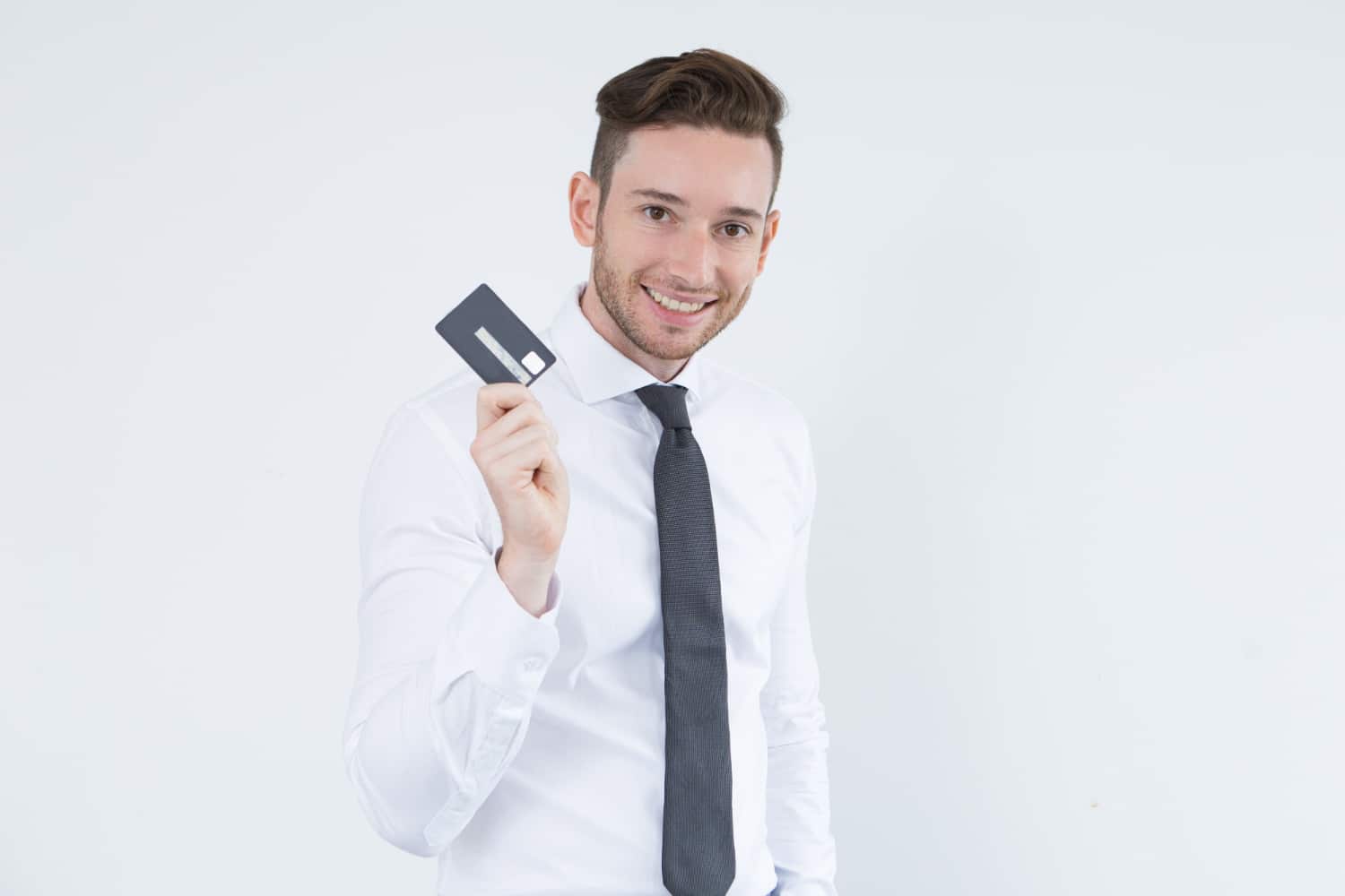 A GUY HOLDING THE Scotia Momentum Business credit card.