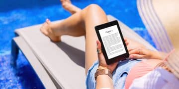 A woman using a Kindle by the pool.
