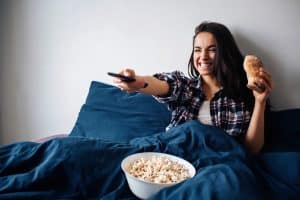 woman watching the most popular TV shows