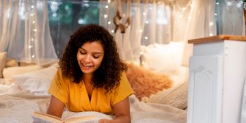 woman enjoying one of the Most Popular Books Published in 2025.