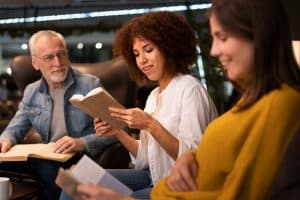 A group of people enjoying 5 Classic Books.